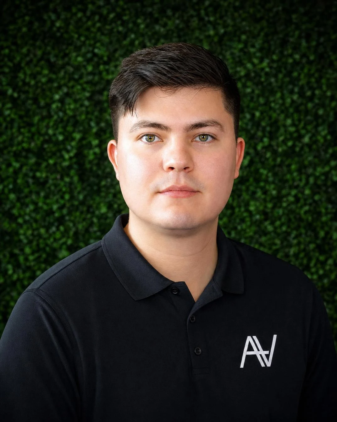 Efrain Torres wearing a black ArmaVita polo